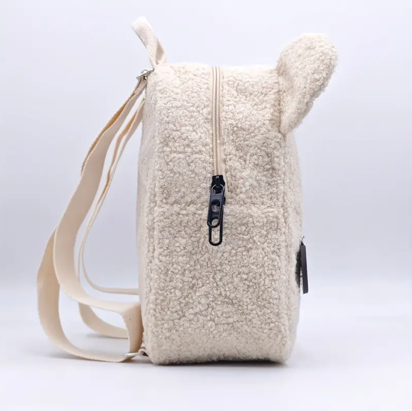 Black zip of teddy bear backpack